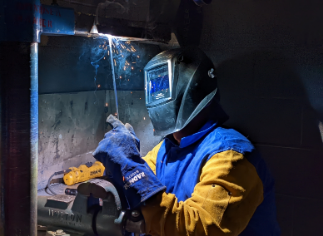 Welding student training to become American Welding Society certified. 